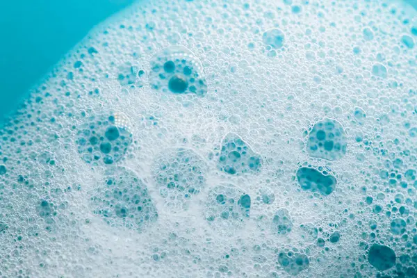 Köpük temizleme ürünleri. Doku köpüğü yakın çekim. Temizlik ve hijyen konsepti. Köpük Su Sabunu Suds.köpük köpüğü.. 