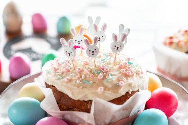 Decorative Easter Cake with Bunny Toppers Easter baking and Easter eggs. festive traditional baking.Easter food.Spring Festive Baking  clipart