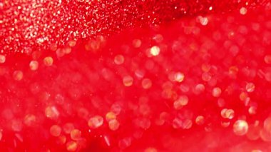Kırmızı parıltılı makro arka plan. Kırmızı parlak kumaş arka plan. Noel ve yeni yıl arkaplanı. 4k görüntü