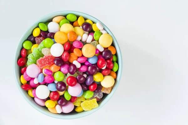 candies in the bowl, colorful candies background, large group of candies