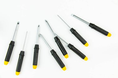Large group of different screwdrivers on the white background