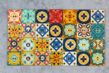 Colorful ornamental button on the gray background, backdrop