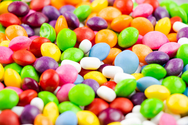 Candy on the white background, high angle view of colorful candies