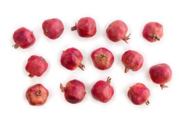 Fresh red pomegranate garnets on white background. Top view, flat lay
