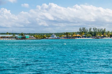 A view towards beaches and small dock on the island of Eleuthera, Bahamas on a bright sunny day