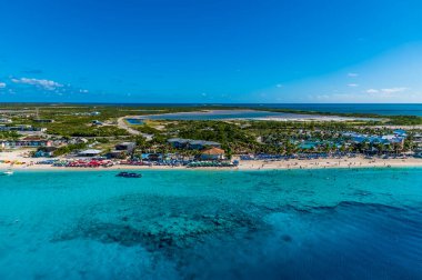 An aerial view over a resort and reservoir on the island of Grand Turk on a bright sunny morning