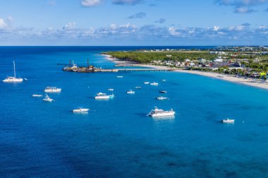 An aerial view along the coast of the island of Grand Turk on a bright sunny morning