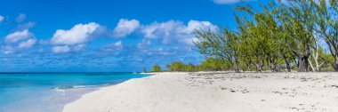 A panorama view along the deserted shore on the island of Grand Turk on a bright sunny morning