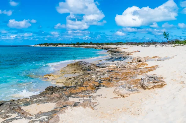 A view along a rocky shoreline on the island of Grand Turk on a bright sunny morning