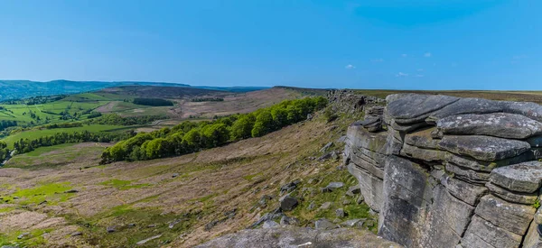 stock image A panorama view looking back along the length of the Stanage Edge escarpment in the Peak District, UK in summertime