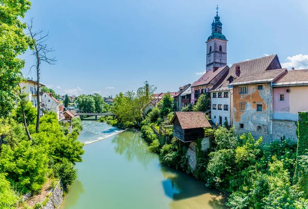 stock image A view down the Selca Sora River from the old town in Skofja Loka, Slovenia in summertime