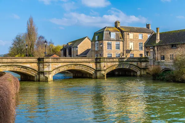 A view from the north bank of the River Welland towards Stamford bridge in Stamford, Lincolnshire, UK in springtime