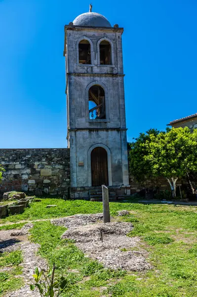 stock image A view towards the tower of the monastery beside the Roman ruins of Apollonia in Albania in summertime