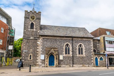 A view towards Saint Pancras church in the center of Chichester, Sussex in summertime clipart