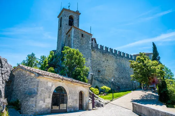 stock image A view towards the first tower in the fortified section of San Marino, Italy in summertime