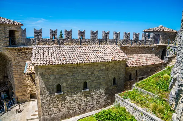 stock image A view over the outer wall and the ramparts in the first tower in the fortified section of San Marino, Italy in summertime