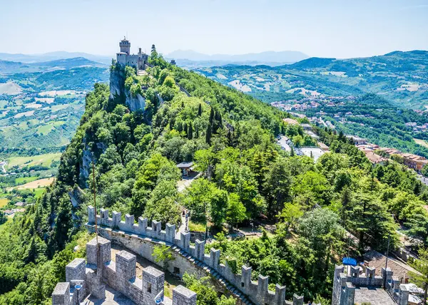 stock image A view towards the second tower from the ramparts of the first tower in the fortified section of San Marino, Italy in summertime