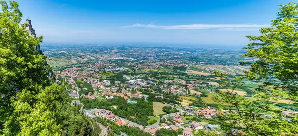 stock image A view down over the lower reaches from the second tower in the fortified section of San Marino, Italy in summertime