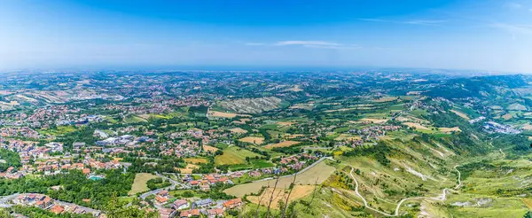 stock image A view from the second tower over the countryside below from the fortified section of San Marino, Italy in summertime