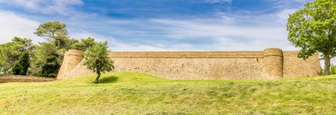 A panorama  view towards the Fortress Albornoz in the city in Urbino, Italy in summertime clipart