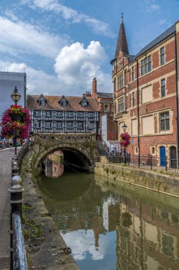 A view along the banks of the River Witham towards the High Bridge in the center of Lincoln, Lincolnshire in summertime