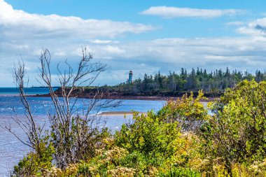 A view along the shore from the southern end of the Confederation bridge, Prince Edward Island, Canada in the fall clipart