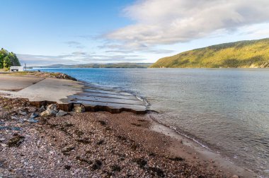 A view along the south shore of the Englishtown Ferry on the Cabot Trail, Nova Scotia, Canada in the fall clipart