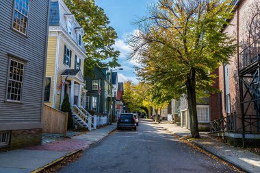 A view down a residential street in Newport, USA in the fall clipart