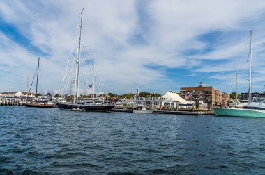 A view along the shoreline towards Bowens Wharf at Newport, USA in the fall clipart