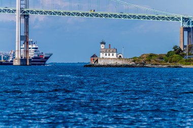 A panorama view across Narragansett bay towards Rose Island and the Newport bridge at Newport, USA in the fall clipart