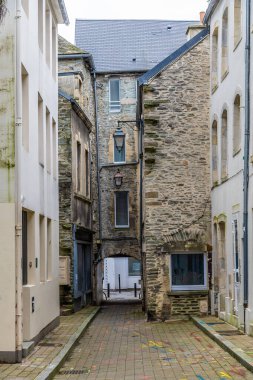 A view down a quaint narrow alleyway at Cherbourg, France in autumn clipart