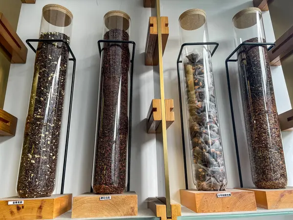 Jars of different varieties of chinese tea in a shop