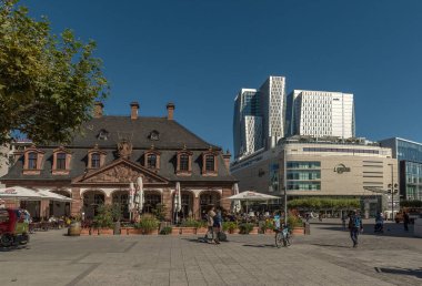 FRANKFURT AM MAIN, GERMANY-AUGUST 23, 2021: Unknown people in the Hauptwache Square in Frankfurt, Germany