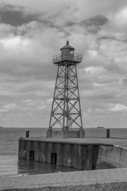 Small green lighthouse at the mouth of the Geeste River in the North Sea, Bremerhaven