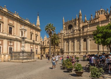 SEVILLE, SPAIN-MAY, 17, 2022: unidentified tourists in Plaza del Triunfo, Seville, Andalusia, Spain