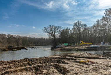 Renaturation work and connection of an oxbow lake, Nidda river in Frankfurt, Germany clipart