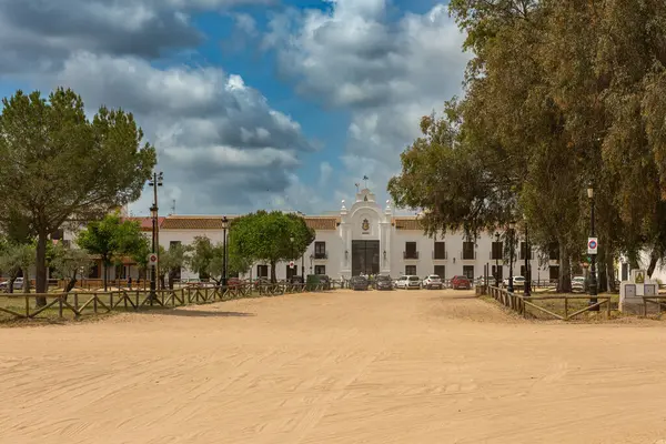 stock image EL ROCIO, SPAIN-MAY 13, 2022: Sand street and brotherhood buildings in El Rocio, Andalusia, Spain