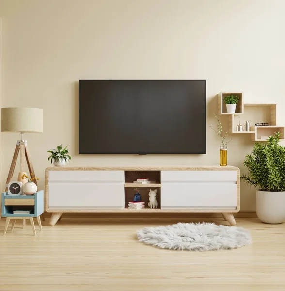 Cream color wall mounted tv on cabinet in living room,minimal design.3d rendering