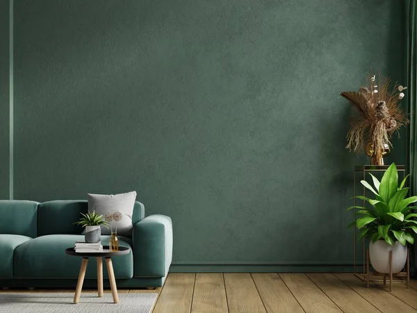 Mockup living room interior with green sofa on empty dark green wall background.3d rendering