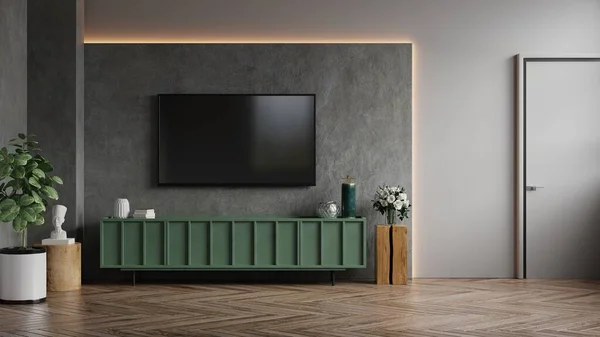 Living room with wall mounted tv and green cabinet on dark concrete color wall background.3d rendering