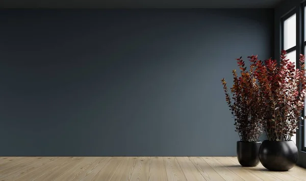 stock image Dark blue wall empty room with plants on a floor.3d rendering