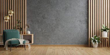 Oturma odasında, boş, koyu beton bir duvarın üzerinde yeşil koltuğu var.