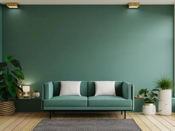 Mockup green wall with green sofa and decor in living room.3d rendering
