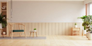 Oturma odasının içinde yeşil yastıklı ahşap bir sandalye, yemyeşil bitkiler ve minimalist dekorasyonla çevrili.