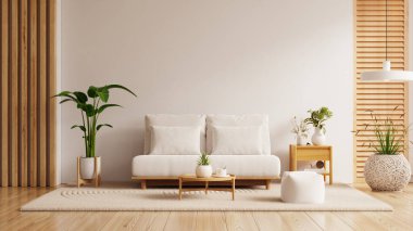 Modern minimalist oturma odasının içinde beyaz duvarlı kanepe ve dekorasyon aksesuarları var.