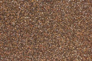 Altının gölgesinde süslü kağıt ya da pullu kumaş.