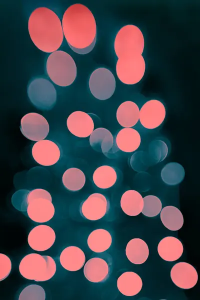 Festive lights bokeh in the form of a Christmas tree