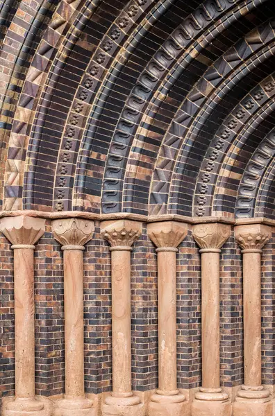 stock image A sculptured church entrance arch with columns in close up