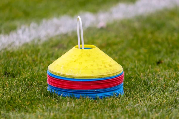 Plastic training chips of yellow, red and blue colors for marking on the football field