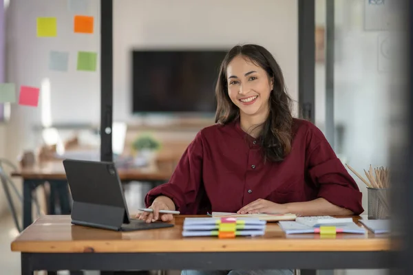 stock image Asian business woman looking at financial documents